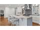 Well-appointed kitchen featuring a spacious island with seating, stainless appliances, and custom cabinets at 4655 Jett Rd, Atlanta, GA 30327