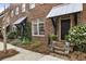 Inviting brick townhomes with well-maintained landscaping, showcasing the exterior appeal at 5821 Clarion St # J8, Cumming, GA 30040