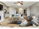 Well-lit living room with a modern fireplace, neutral palette, and open layout into the kitchen at 5821 Clarion St # J8, Cumming, GA 30040