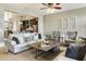 Cozy living room featuring neutral tones, comfortable seating, and open access to the modern kitchen at 5821 Clarion St # J8, Cumming, GA 30040