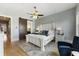 Inviting main bedroom featuring a sliding barn door, ensuite bath and stylish decor at 5821 Clarion St # J8, Cumming, GA 30040