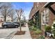 Street view of a brick building showing sidewalks, street parking, and beautiful landscaping at 5821 Clarion St # J8, Cumming, GA 30040