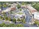 Aerial view of a vibrant town center with brick buildings, shops, dining, and ample parking at 5821 Clarion St # J8, Cumming, GA 30040