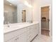 Bathroom features double vanity sinks, white cabinets, and a glass shower at 6505 Cortland Walk, Alpharetta, GA 30005