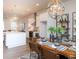 Eat-in kitchen dining area featuring decorative chandelier and stainless steel appliances at 6505 Cortland Walk, Alpharetta, GA 30005