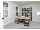 Well-lit home office featuring a large window, built-in shelving, and wooden desk at 6505 Cortland Walk, Alpharetta, GA 30005