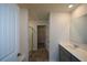 Bathroom featuring a sink with gray cabinets and a walk-in shower at 67 Highgrove Way, Dallas, GA 30157