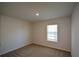 Empty bedroom with carpet and a window providing natural light at 67 Highgrove Way, Dallas, GA 30157