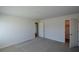 Bedroom featuring neutral walls and carpet, with doors to a closet and hallway at 67 Highgrove Way, Dallas, GA 30157