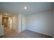 Spacious bedroom with neutral carpet and view of hallway and doorway at 67 Highgrove Way, Dallas, GA 30157