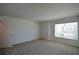 Inviting bedroom with a window providing natural light and neutral-toned carpet at 67 Highgrove Way, Dallas, GA 30157