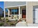 Inviting front porch with chairs and flowers, creating a cozy outdoor space at 67 Highgrove Way, Dallas, GA 30157