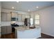 Kitchen featuring a center island, stainless steel appliances, gray cabinets, and granite countertops at 67 Highgrove Way, Dallas, GA 30157