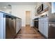 Kitchen featuring stainless steel appliances, grey cabinets, granite countertops, and hardwood floors at 67 Highgrove Way, Dallas, GA 30157