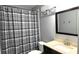 Full bathroom featuring a vanity with a granite countertop and a shower with a gray shower curtain at 2674 Misty Rock Cv, Dacula, GA 30019