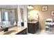 Well-lit bathroom with dual vanities, granite countertops, and separate tub and shower at 2674 Misty Rock Cv, Dacula, GA 30019