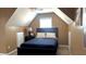 Cozy bedroom with a full size bed, a dark wood headboard, and a window for natural light at 2674 Misty Rock Cv, Dacula, GA 30019