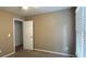 Empty bedroom with neutral walls, carpet, a ceiling fan, a window, and a closet at 2674 Misty Rock Cv, Dacula, GA 30019