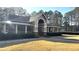 Community clubhouse with brick accents, neutral paint, and manicured landscaping provides a welcoming space for gatherings at 2674 Misty Rock Cv, Dacula, GA 30019