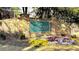 Apalachee River Club's stone entrance sign surrounded by vibrant landscaping and colorful flower beds at 2674 Misty Rock Cv, Dacula, GA 30019