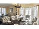 Bright dining area features a table with set places and an integrated view of the adjoining office space at 2674 Misty Rock Cv, Dacula, GA 30019
