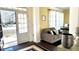 Inviting entryway featuring a view to the outside and a comfortable seating area with yellow walls at 2674 Misty Rock Cv, Dacula, GA 30019