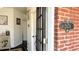 Charming foyer view showing the front door, address and a glimpse of the home's interior at 2674 Misty Rock Cv, Dacula, GA 30019