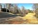 View of the Apalachee River Club's golf course showing a portion of the cart path at 2674 Misty Rock Cv, Dacula, GA 30019