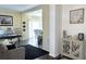 Comfortable living area features hardwood floors, neutral walls, and a partial view into the dining room at 2674 Misty Rock Cv, Dacula, GA 30019
