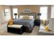 Spacious main bedroom featuring a seating area, neutral color palette, and lots of natural light at 2674 Misty Rock Cv, Dacula, GA 30019