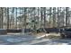 Community playground with slides and swings set nestled near parking provides an area for fun and activity at 2674 Misty Rock Cv, Dacula, GA 30019