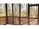 Enclosed porch with scenic backyard views, providing an ideal space for relaxation and enjoyment at 2674 Misty Rock Cv, Dacula, GA 30019
