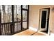 Charming enclosed porch with natural wood flooring and access to backyard at 2674 Misty Rock Cv, Dacula, GA 30019