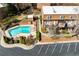 Aerial view of a pool and townhomes with brick exteriors and well-kept grounds at 1261 Lavista Ne Rd # E9, Atlanta, GA 30324