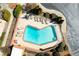 Aerial view of a pristine blue heart-shaped community pool with ample lounging space at 1261 Lavista Ne Rd # E9, Atlanta, GA 30324