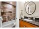 Well-appointed bathroom featuring a stone shower, granite countertop, and modern fixtures at 1261 Lavista Ne Rd # E9, Atlanta, GA 30324