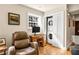 Home office space that includes laundry behind closet doors, wooden desk, and reading space at 1261 Lavista Ne Rd # E9, Atlanta, GA 30324