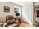 Comfortable home office featuring a wooden desk, recliner, and ample natural light at 1261 Lavista Ne Rd # E9, Atlanta, GA 30324