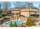 Community pool surrounded by lush landscaping and well-maintained brick buildings at 1261 Lavista Ne Rd # E9, Atlanta, GA 30324