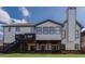 The backyard of this home has a deck and stairs leading to a stone patio at 2077 Towne Mill Ave, Canton, GA 30114