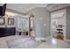 Large bathroom featuring double sinks, a soaking tub under a window, and a glass shower enclosure at 2077 Towne Mill Ave, Canton, GA 30114