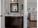 Bathroom vanity featuring a white countertop and dark wood cabinets at 2077 Towne Mill Ave, Canton, GA 30114