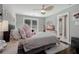 Bedroom featuring a full bed, ceiling fan, and view to the ensuite bathroom at 2077 Towne Mill Ave, Canton, GA 30114