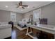 Bright bedroom with a ceiling fan, white trim, and desk at 2077 Towne Mill Ave, Canton, GA 30114