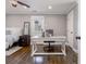 Bedroom with a small desk near a sunny window and dark stained hardwood flooring at 2077 Towne Mill Ave, Canton, GA 30114