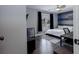 Bedroom with hardwood floors and a wood accent wall at 2077 Towne Mill Ave, Canton, GA 30114