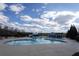 The community pool has a large swimming area and waterslide in a fenced-in area at 2077 Towne Mill Ave, Canton, GA 30114