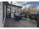 Relaxing deck with dark wood flooring and blue patio furniture, including a grill at 2077 Towne Mill Ave, Canton, GA 30114