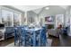 Well-lit dining area features a blue table set, fireplace, and vaulted ceilings at 2077 Towne Mill Ave, Canton, GA 30114