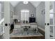 Bright home office space with vaulted ceilings, neutral paint and a traditional-style desk and hardwood floors at 2077 Towne Mill Ave, Canton, GA 30114